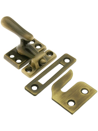 Solid Brass Casement Latch Set In Antique Brass.